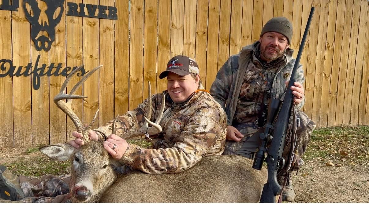 A group sharing a hunting memory with a whitetail