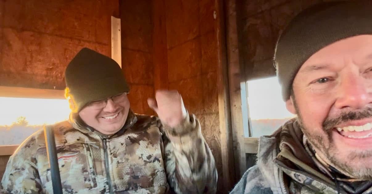 Shawn Chatham in the field with a hunting companion