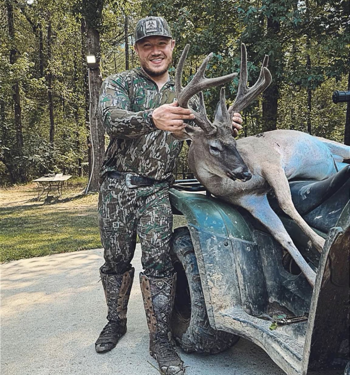 A hunter sharing a field moment with a whitetail
